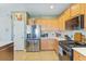 Well-equipped kitchen with stainless steel appliances, light wood cabinets, and decorative backsplash at 743 Redbud Ln, Summerville, SC 29486
