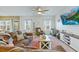 Cozy living room with a ceiling fan, a large television, and comfortable seating at 743 Redbud Ln, Summerville, SC 29486