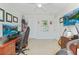 Spacious home office featuring a large desk with computer and a ceiling fan for enhanced comfort at 743 Redbud Ln, Summerville, SC 29486