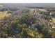 Captured from above, dwellings are situated in a densely wooded neighborhood at 754 Miriam Ln, Ridgeville, SC 29472