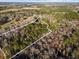 Aerial view of a property surrounded by dense trees and open fields, with a white outline at 754 Miriam Ln, Ridgeville, SC 29472