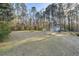 View of backyard with a small storage shed and wooded backdrop at 754 Miriam Ln, Ridgeville, SC 29472