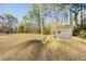Backyard features a storage shed on a grassy area, perfect for outdoor activities at 754 Miriam Ln, Ridgeville, SC 29472