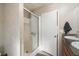 Clean bathroom with a glass-enclosed shower, double sink vanity, and an open doorway creating an airy, functional space at 754 Miriam Ln, Ridgeville, SC 29472