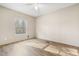 Sunlit bedroom featuring stylish wood-look flooring, a ceiling fan, and a large window that brings the outside in at 754 Miriam Ln, Ridgeville, SC 29472