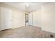Open bedroom featuring wood-look flooring, a ceiling fan, and a view into another room through an open door at 754 Miriam Ln, Ridgeville, SC 29472