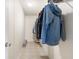 Organized walk-in closet showcasing tile flooring, ample hanging space, and built-in shelving for optimal storage solutions at 754 Miriam Ln, Ridgeville, SC 29472