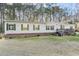 Charming single-story home with green shutters, a brick foundation, and a cozy front porch at 754 Miriam Ln, Ridgeville, SC 29472