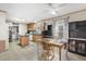 Bright kitchen area with wooden cabinets, an adjacent dining space, and tile flooring at 754 Miriam Ln, Ridgeville, SC 29472