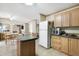 Spacious kitchen with an island, wooden cabinetry, and stainless steel appliances at 754 Miriam Ln, Ridgeville, SC 29472