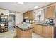 Functional kitchen with wooden cabinets, ample counter space, and modern appliances at 754 Miriam Ln, Ridgeville, SC 29472