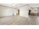 Open-concept living area with wood-look floors seamlessly flowing into the kitchen at 754 Miriam Ln, Ridgeville, SC 29472