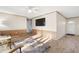 Comfortable living room with stylish flooring, flat-screen TV, and lots of natural light at 754 Miriam Ln, Ridgeville, SC 29472