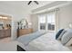 Spacious bedroom featuring a large window, tray ceiling, and neutral color palette at 758 Blueway Ave, Summerville, SC 29486