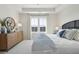 Bright bedroom with white carpet, modern decor, and a large window at 758 Blueway Ave, Summerville, SC 29486