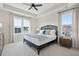 This bedroom has a tray ceiling, large windows and neutral decor at 758 Blueway Ave, Summerville, SC 29486