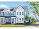 Charming two-story townhomes with blue and white siding and inviting front porches on a sunny day at 758 Blueway Ave, Summerville, SC 29486
