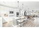 Bright, open kitchen features a center island with seating and seamlessly connects to the dining and living areas at 758 Blueway Ave, Summerville, SC 29486