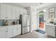 Bright kitchen with stainless steel appliances, white cabinets, and modern countertops at 758 Blueway Ave, Summerville, SC 29486