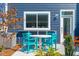 Cozy outdoor space featuring a table with chairs, a lush plant, and a view of the well-maintained yard at 758 Blueway Ave, Summerville, SC 29486