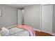 Bedroom with neutral walls features hardwood floors and a double door closet at 760 Royle Rd, Ladson, SC 29456