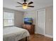 Bedroom with hardwood floors, ceiling fan, and a window for natural light at 760 Royle Rd, Ladson, SC 29456