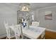 Dining room with a chandelier with a white table with a blue table cloth at 760 Royle Rd, Ladson, SC 29456
