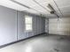 Clean and well-maintained garage with a fresh coat of gray paint and a functional garage door opener at 760 Royle Rd, Ladson, SC 29456