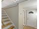 Hallway featuring light-colored wood stairs, a white door, and neutral walls at 760 Royle Rd, Ladson, SC 29456
