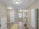 Hallway with neutral walls and tile floors featuring a window at the end at 760 Royle Rd, Ladson, SC 29456