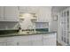 Kitchen featuring stainless steel sink and faucet, white cabinets and granite countertops at 760 Royle Rd, Ladson, SC 29456