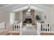 Inviting living room featuring vaulted ceilings, a brick fireplace, and comfortable seating at 760 Royle Rd, Ladson, SC 29456