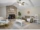 Cozy living room with vaulted ceilings, brick fireplace, ceiling fan, and stylish decor at 760 Royle Rd, Ladson, SC 29456