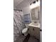 Bathroom features a shower, tub, marble curtain, modern vanity and new lighting for a clean and updated space at 7955 Timbercreek Ln # 1807, North Charleston, SC 29418