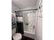 Clean white bathtub and shower with modern fixtures and dark shower curtain at 7955 Timbercreek Ln # 1807, North Charleston, SC 29418