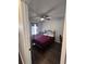 Bedroom with dark wood floors, ceiling fan, and natural light creates a relaxing and inviting space at 7955 Timbercreek Ln # 1807, North Charleston, SC 29418