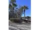Signage for 'The Park at Rivers Edge' with palm trees and landscaping at 7955 Timbercreek Ln # 1807, North Charleston, SC 29418