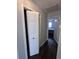 Hallway with closet and open doorway leading to a bedroom, offering convenience and accessibility at 7955 Timbercreek Ln # 1807, North Charleston, SC 29418