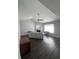 Open-concept living room with fireplace, vaulted ceiling, and dark wood flooring at 7955 Timbercreek Ln # 1807, North Charleston, SC 29418