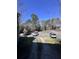 Open parking lot with multiple vehicles, surrounded by mature trees at 7955 Timbercreek Ln # 1807, North Charleston, SC 29418