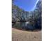 Scenic pond with a fountain, surrounded by tall pine trees at 7955 Timbercreek Ln # 1807, North Charleston, SC 29418