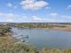 Aerial view of waterfront community with private boat docks on a waterway at 95 Plymouth Ave, Charleston, SC 29412