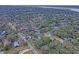 Scenic aerial view of a charming neighborhood with tree-lined streets and diverse architecture at 95 Plymouth Ave, Charleston, SC 29412