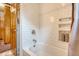 Cozy bathroom featuring a tiled shower and convenient built-in shelving at 95 Plymouth Ave, Charleston, SC 29412
