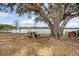 Coastal lot features a waterside picnic area with stone table under the shade of a beautiful, moss-laden tree at 95 Plymouth Ave, Charleston, SC 29412