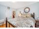 Charming bedroom featuring a floral patterned bedspread, hardwood floors, and a vintage dresser at 95 Plymouth Ave, Charleston, SC 29412