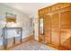 Bedroom features a large closet, decorative mirror, hardwood floors and accent lighting at 95 Plymouth Ave, Charleston, SC 29412