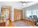 Bedroom with hardwood floors, ceiling fan, closet and a bright window at 95 Plymouth Ave, Charleston, SC 29412