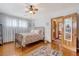 Bedroom features hardwood floors, ceiling fan, natural light, and an attached bathroom at 95 Plymouth Ave, Charleston, SC 29412