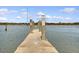 Dock extends onto the water for easy boat access, surrounded by calm waters and clear skies at 95 Plymouth Ave, Charleston, SC 29412